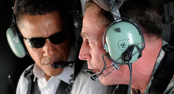 U.S. presidential candidate Barack Obama, left, and top U.S. military commander in Iraq, David Petraeus, talk as they take a helicopter ride