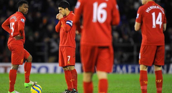 Liverpool's Daniel Sturridge (left) and Luis Suarez (second left) stand dejected after conceding their third goal of the game today. Picture: PA