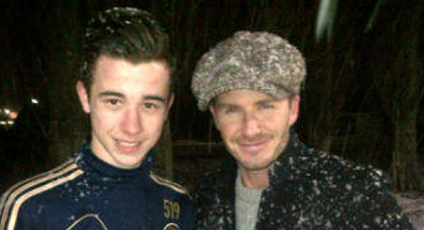 David Beckham pictured with a fan outside Chelsea's Cobham training ground yesterday. Picture via Twitter/@reyondillon
