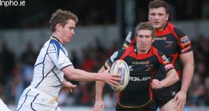 Leinster's Eoin Reddan clears the ball under pressure from Dragons' Wayne Evans. Picture: iNPHO/Huw Evans