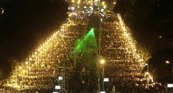 Egyptian protesters gather outside the presidential palace after they broke through a barbed wire barricade in Cairo overnight. Picture: AP