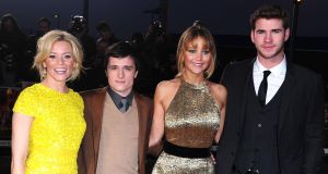Jennifer Lawrence (third left) with 'Hunger Games' co-stars Elizabeth Banks, Josh Hutcherson and Liam Hemsworth at the film's London premiere last night.