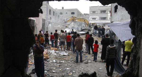 Palestinian firefighters work at the scene of an Israeli air strike on a building in the Jebaliya refugee camp in the northern Gaza Strip. Picture: AP