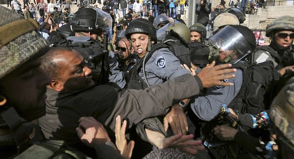 Israeli police and Muslim worshippers who were prevented from entering the Al-Aqsa mosque compound for prayers, scuffle in Jerusalem's Old City.