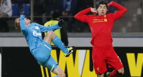 Liverpool's Luis Suarez, right, in action with Zenit's Aleksandr Anyukov tonight.