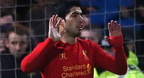 Hands up! Suarez celebrates his goal yesterday