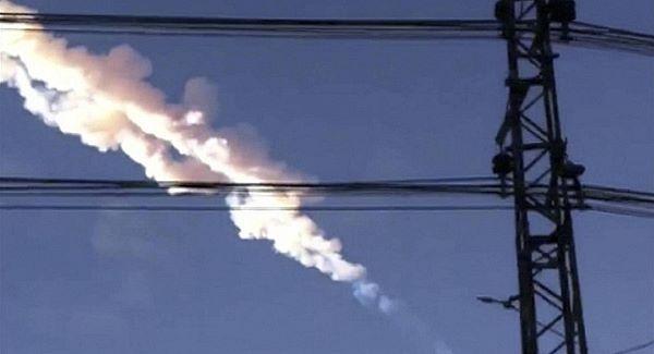 In this photo taken with a mobile phone camera, a meteorite contrail is seen in Chelyabinsk region of Russia today. Picture: AP