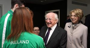 President Michael D Higgins and his wife Sabina meet Irish paralympic athlete Michael McKillop and rower Sarah Caffrey during a visit to the Olympic Stadium in Stratford, London today.