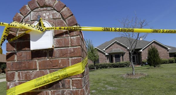 Crime scene tape is seen outside the home of Kaufman County District Attorney Mike McLelland and his wife. Picture: AP