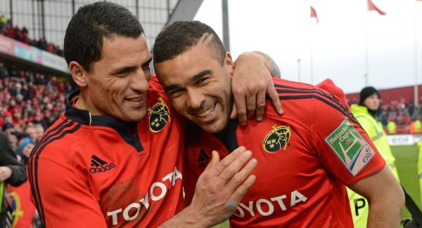 Munster's Simon Zebo is congratulated by captain Doug Howlett after the game.Picture: SPORTSFILE
