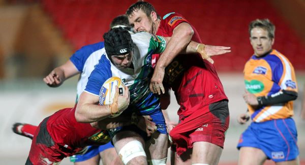 Mike Kearney, Connacht, is tackled by Johan Snyman and George Earle, Scarlets. Picture: SPORTSFILE