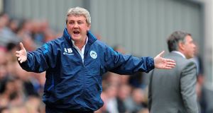 Wigan Athletic manager Steve Bruce complains about a decision on the touchline during the Barclays Premier League match at Ewood Park, Blackburn.