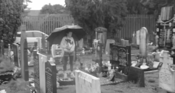 Alex at her father's grave