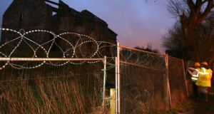 Workers fixing fences around the Glenatore development outside Athlone, Co Westmeath were a toddler was found dead in a pool of water. Picture: Hany Marzouk
