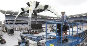 Workers dismantle the U2 stage in Croke Park this morning.