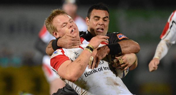 Luke Marshall, Ulster, is tackled by Kahn Fotuali'i, Ospreys. Picture: SPORTSFILE