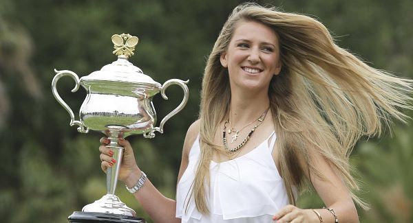 Victoria Azarenka of Belarus poses with the Australian Open trophy in the Royal Botanical Gardens following her win over China's Li Na in the women's final, in Melbourne, Australia.